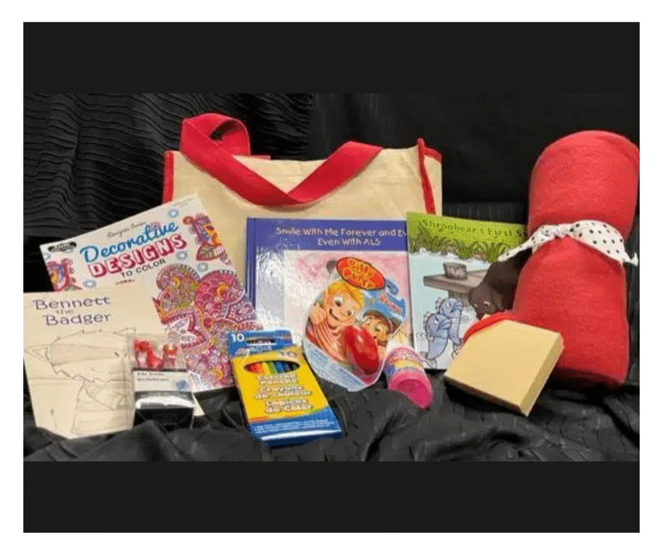 Kids Bag and some items it includes: journal, pencils, coloring book, silly putty and blanket
